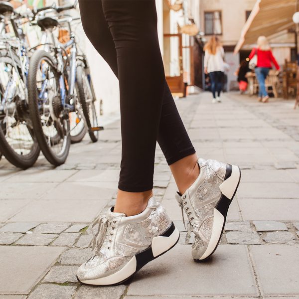 young beautiful stylish hipster woman in pink leather jacket, glam rock style, summer trend outfit, legs close up, shoes details